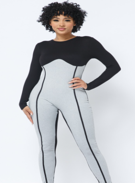 The Beyond Bae romper features a heather grey and black color blocking with a front contour outline. The back of the romper is solid black and has a lot of stretch so its safe to say this outfit is a slay.