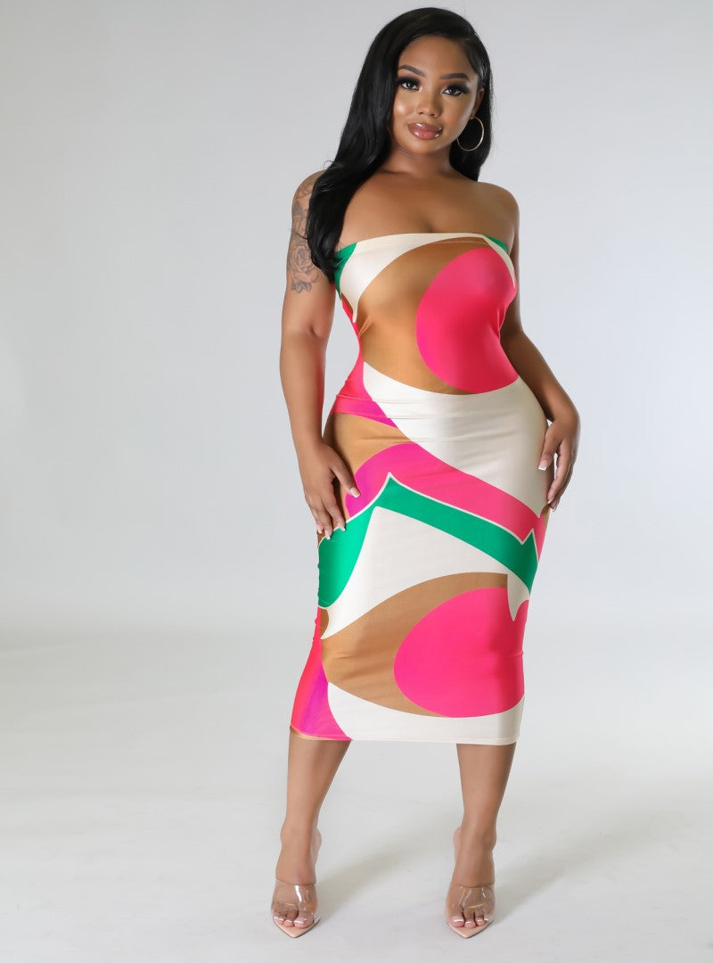 Our Brielle dress is a midi, bodycon tube dress with a vibrant lively print, This dress has a lot of stretch and can easily transition from a busy day to a relaxed evening. **Model is wearing a small**
