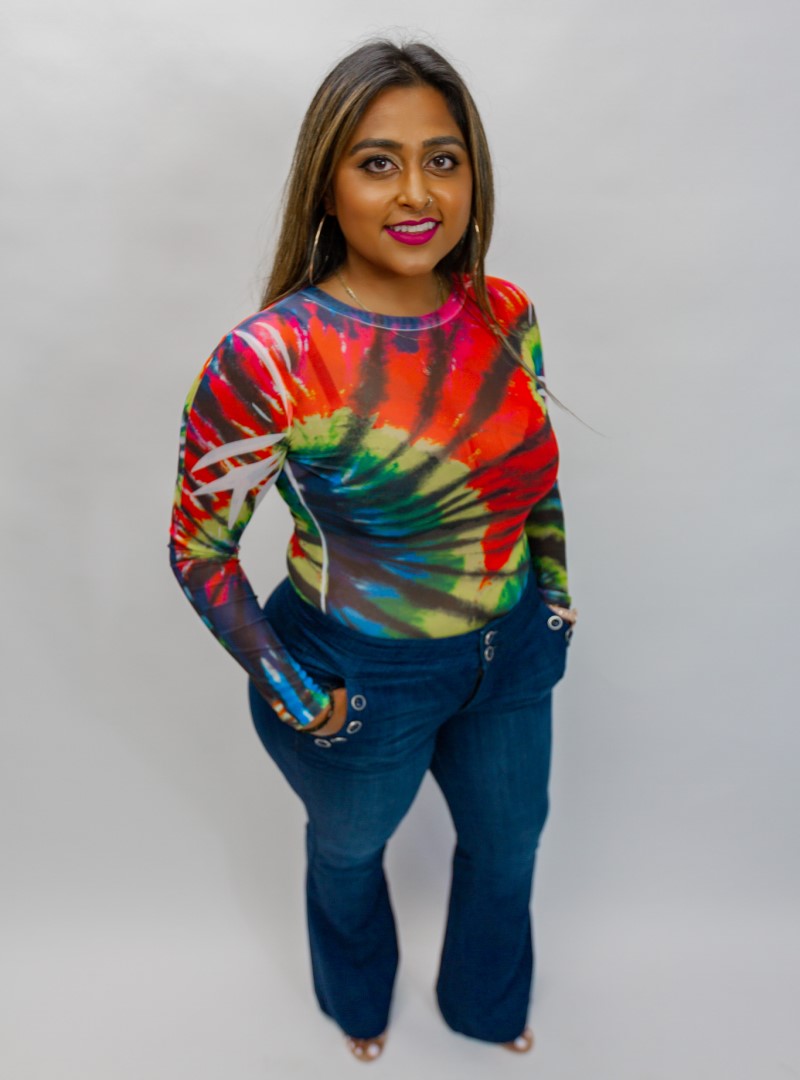 This tie dye bodysuit features a grand kaleidoscope of colors, that create a fun and adventurous vibe. Pairs well with casual looks.