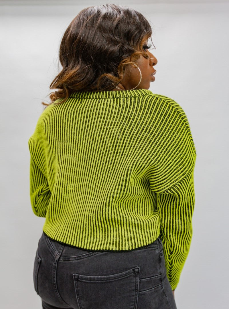 Our " Neon Flex" sweater is a fun addition to your wardrobe. It features a cropped hem, and vertical black stripes on a highlighter neon solid. This top is ready for a good time.
