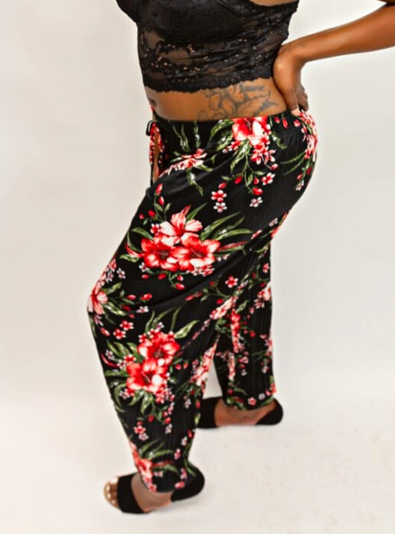 Both stylish and comfortable, the Camellia Pant is features a full floral print, super stretchy, super comfy, wide leg lounge pant with a faux draw string. These loose-fitting pants make great loungewear.